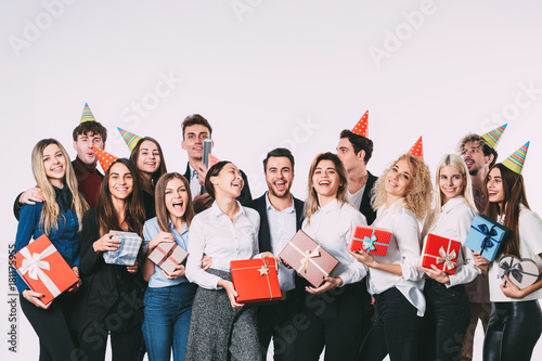 Holidays Concept. Group of people colleagues with gifts in hands.