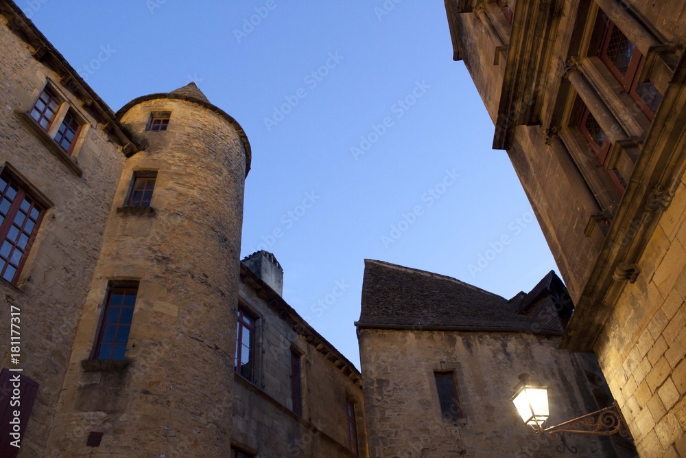 Sarlat village with its towers and a lamppost, France