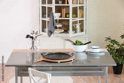 kitchen accessory on the metal table with kitchen cupboard in the home