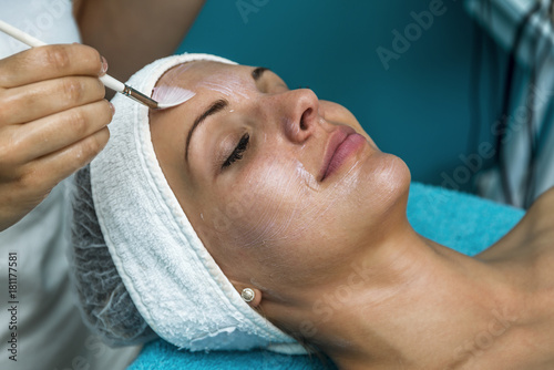 Caucasian woman relaxing in a spa bed and enjoying the treatment. photo