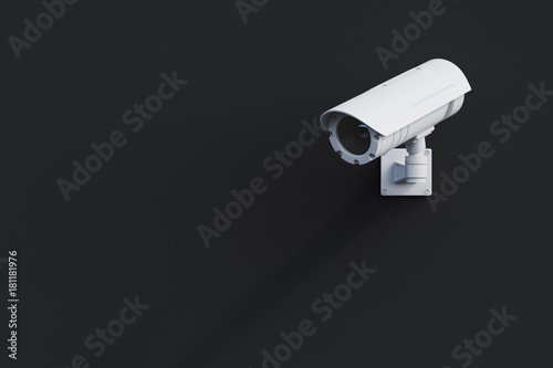 White CCTV camera on a black wall