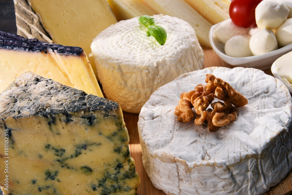 Different sorts of cheese on kitchen table Different sorts of cheese on kitchen table