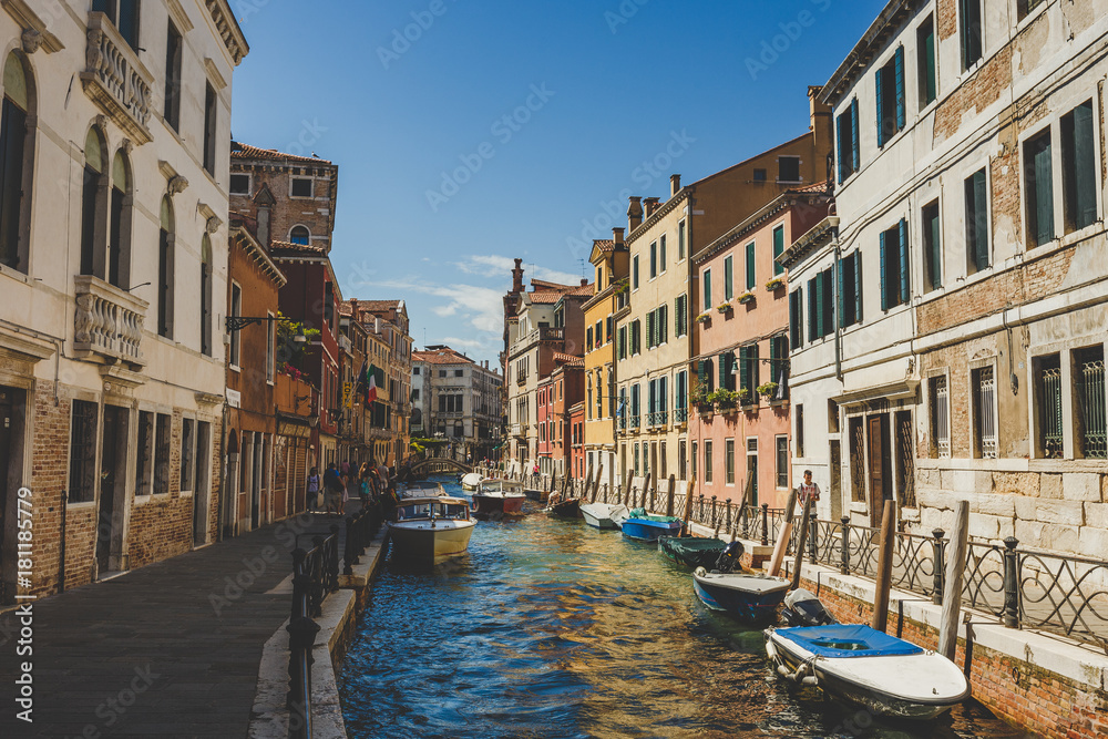 Venice cityscape, narrow water canal, bridge and traditional buildings. Italy