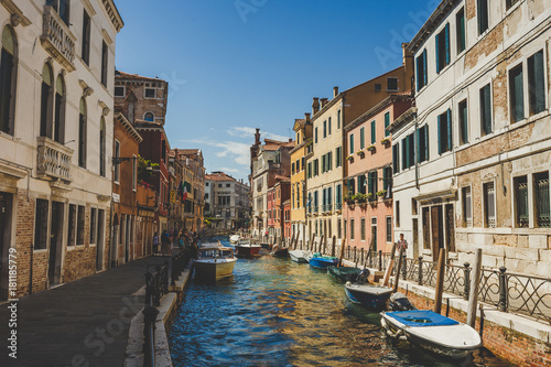 Venice cityscape, narrow water canal, bridge and traditional buildings. Italy