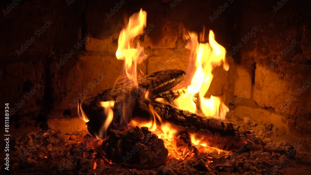 A fire burns in a fireplace, Fire to keep warm A fire burns in a fireplace, Fire to keep warm