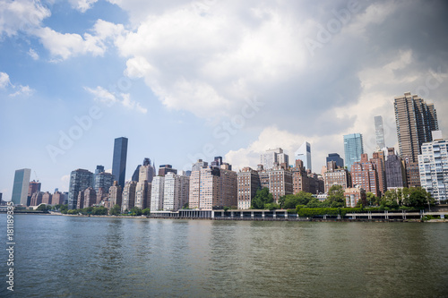 New York City skyline viewed across the East River from Roosevelt Island waterfront. © lazyllama
