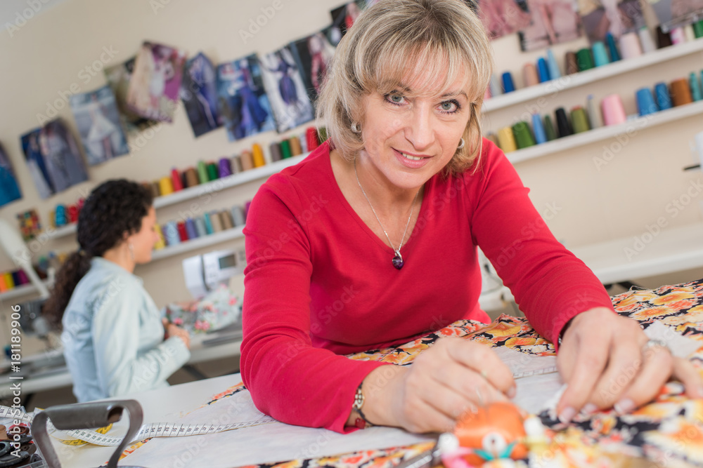 Fototapeta premium female dressmaker choosing materials