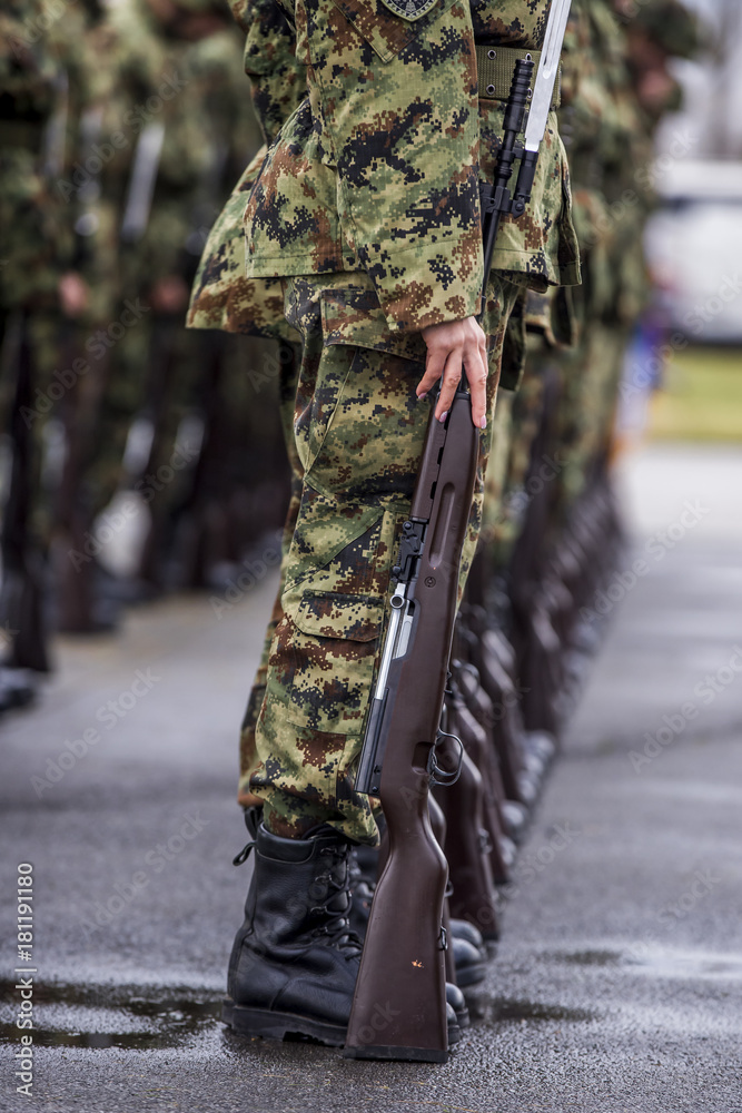 Soldiers stand in row. Gun in hand. Army, Military Boots lines of