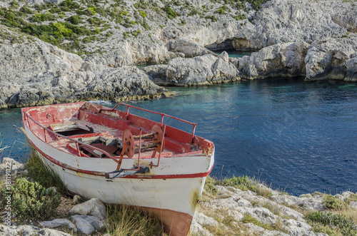 mountain boat and blue cave photo