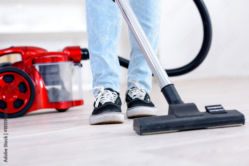 Fototapeta premium vacuum cleaning the floor