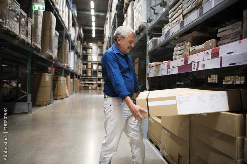 Caucasian man is lifting  thing from shelf