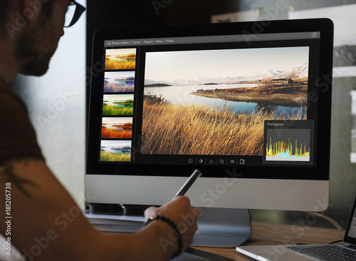 Man editing photos on a computer photo