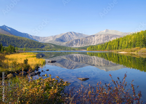 Nature scenic view of a mountain and a body of water.