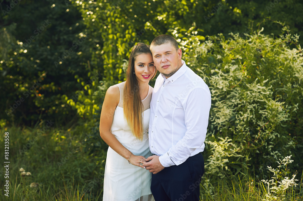 Beautiful wedding couple in a Park. Wedding day of a young couple . Portrait of the bride and groom close-up Beautiful wedding couple in a Park. Wedding day of a young couple . Portrait of the bride and groom close-up