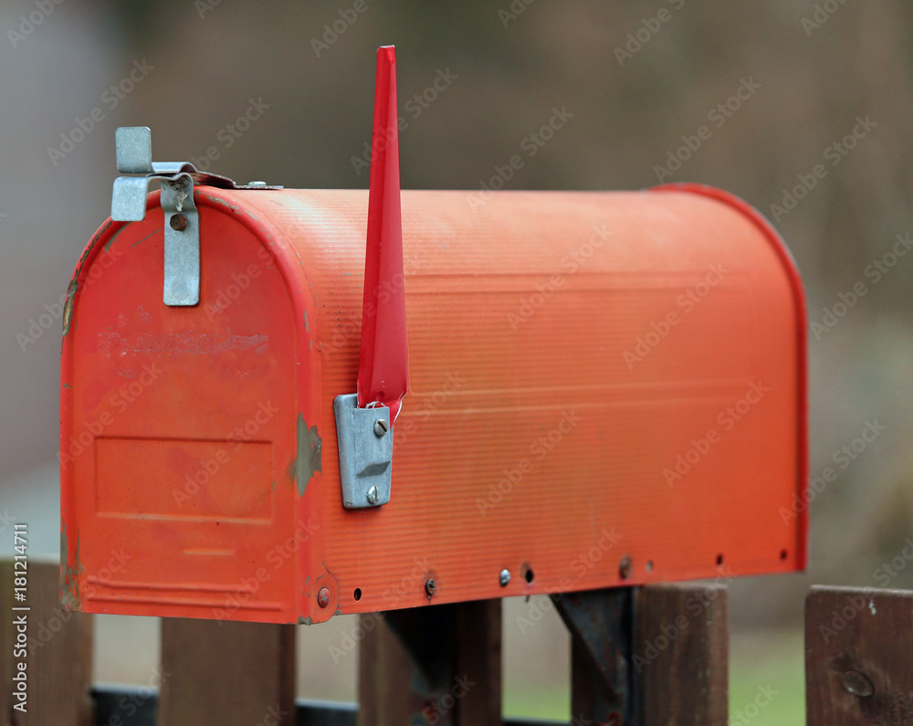 red letterbox with the raised rod to signal the presence of mail red letterbox with the raised rod to signal the presence of mail