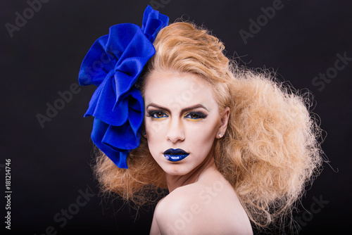 beauty model wearing a blue bow model with seductive eyes and perfect skin and amazing hair