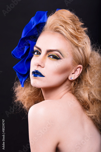 beauty model wearing a blue bow model with seductive eyes and perfect skin and amazing hair