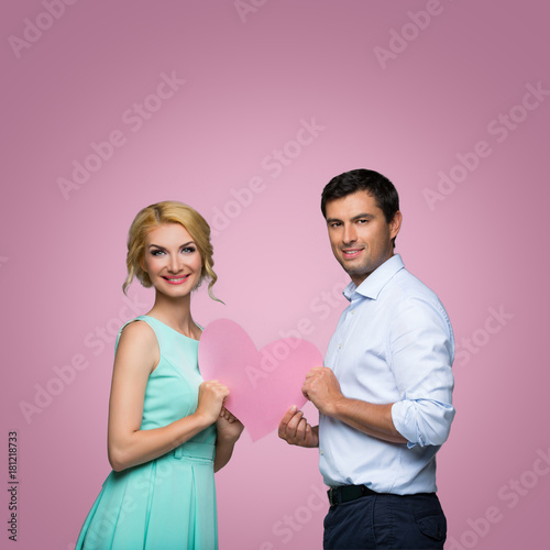 Beautiful couple holding pink heart