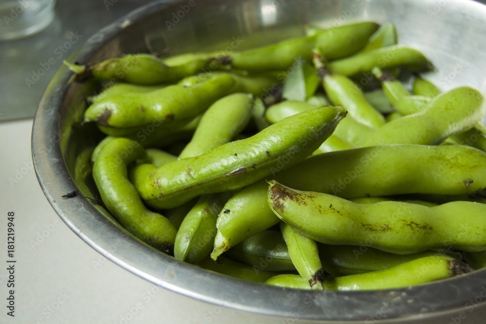 Pods of bean in a bowl