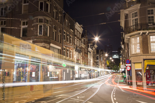 Fototapeta Naklejka Na Ścianę i Meble -  Tram moving fast at night in Amsterdam