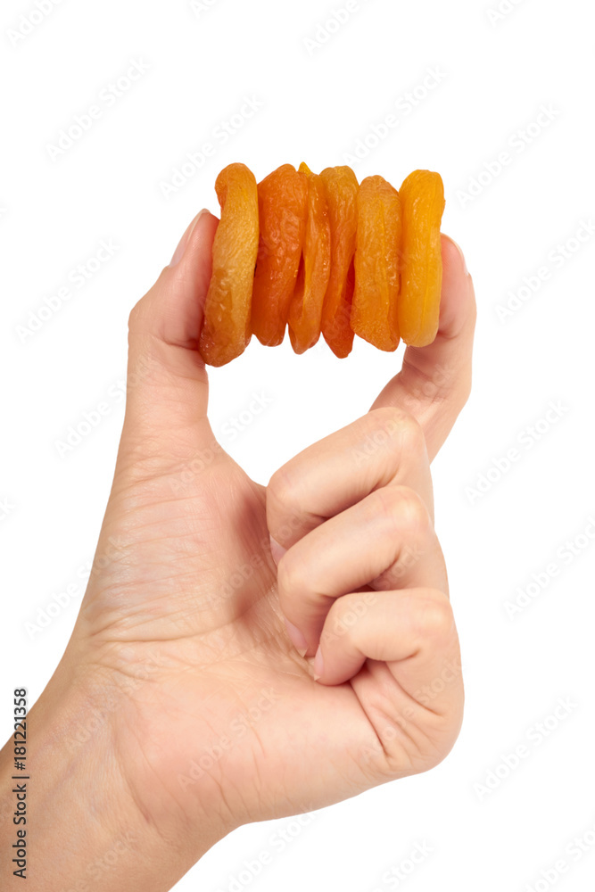delicious and healthy dried apricots in hand isolated on white background, healthy sweet snack delicious and healthy dried apricots in hand isolated on white background, healthy sweet snack