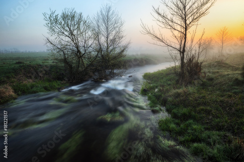 spring morning. a picturesque river. foggy dawn
