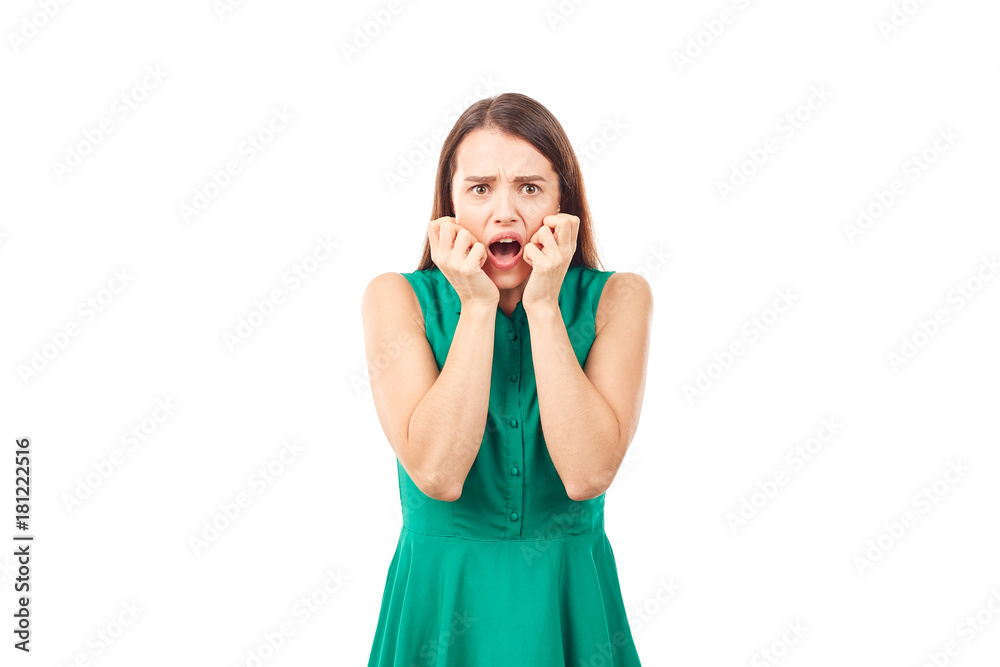 Portrait of emotional young woman in emerald green dress on white background Portrait of emotional young woman in emerald green dress on white background