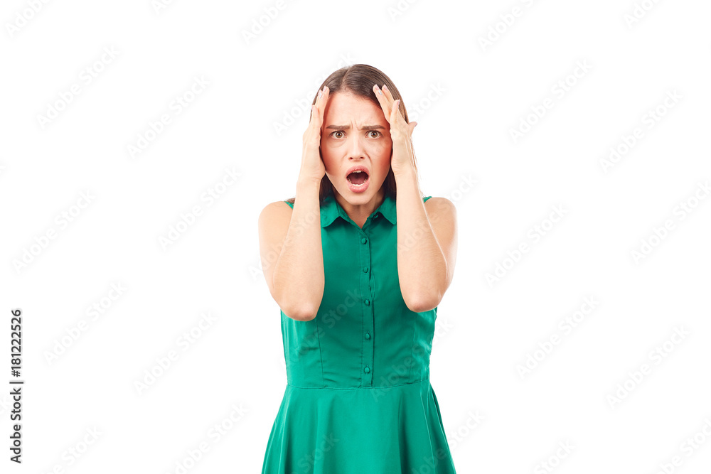 Portrait of emotional young woman in emerald green dress on white background Portrait of emotional young woman in emerald green dress on white background