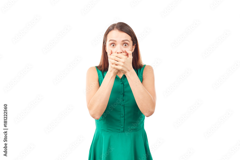 Portrait of emotional young woman in emerald green dress on white background Portrait of emotional young woman in emerald green dress on white background