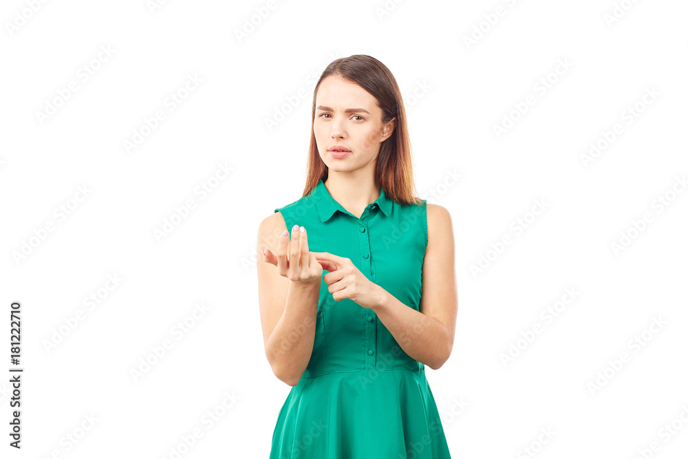 Portrait of emotional young woman in emerald green dress on white background Portrait of emotional young woman in emerald green dress on white background