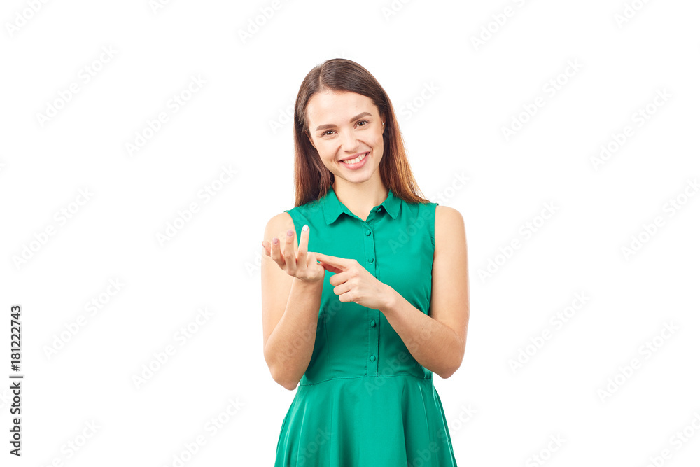 Portrait of emotional young woman in emerald green dress on white background Portrait of emotional young woman in emerald green dress on white background