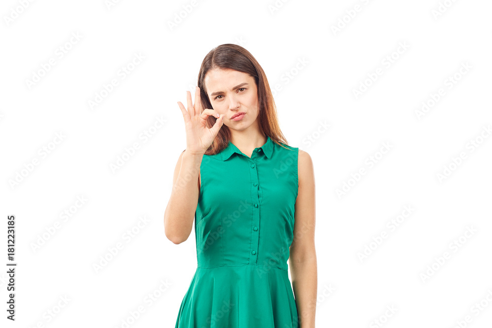 Portrait of emotional young woman in emerald green dress on white background Portrait of emotional young woman in emerald green dress on white background