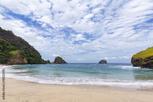 Blue waters in the left portion of the Koka beach area in Paga, Indonesia. © Danaan