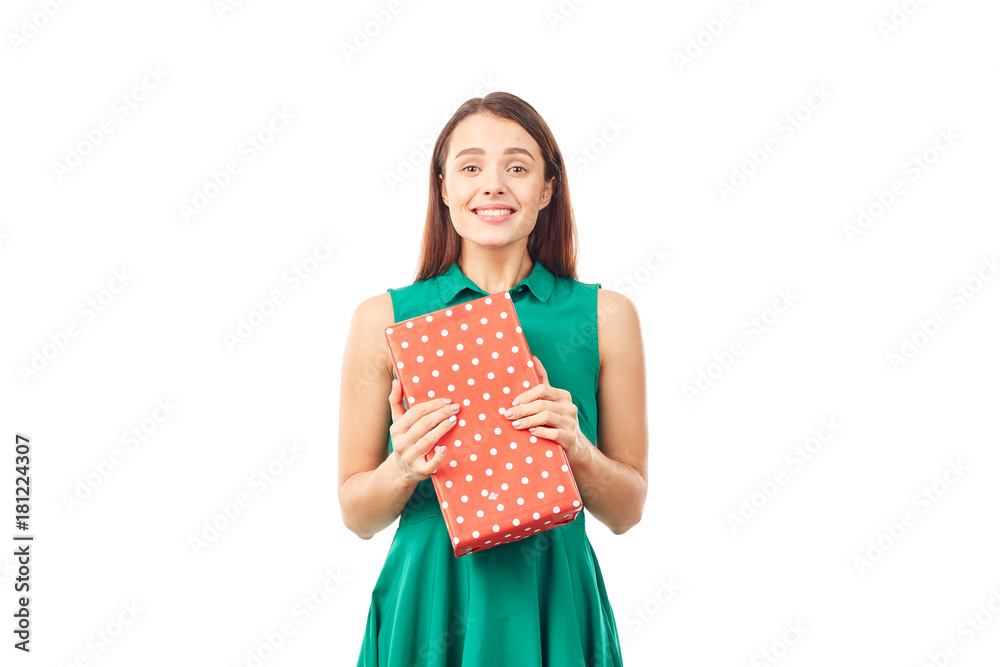 Portrait of young woman holding gift box wrapped in red paper Portrait of young woman holding gift box wrapped in red paper
