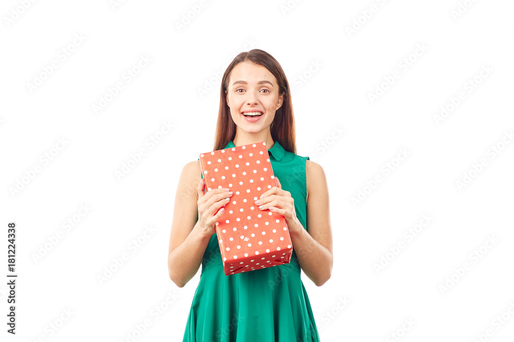 Portrait of young woman holding gift box wrapped in red paper Portrait of young woman holding gift box wrapped in red paper