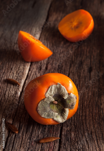 Persimmons on Old Wood Surface