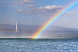 Rainbow over Lake Geneva in drops of fountain