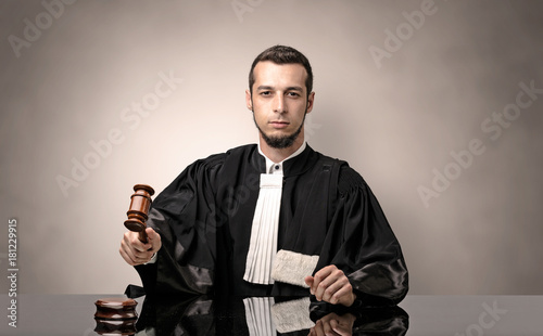 Oldscool young judge in gown photo