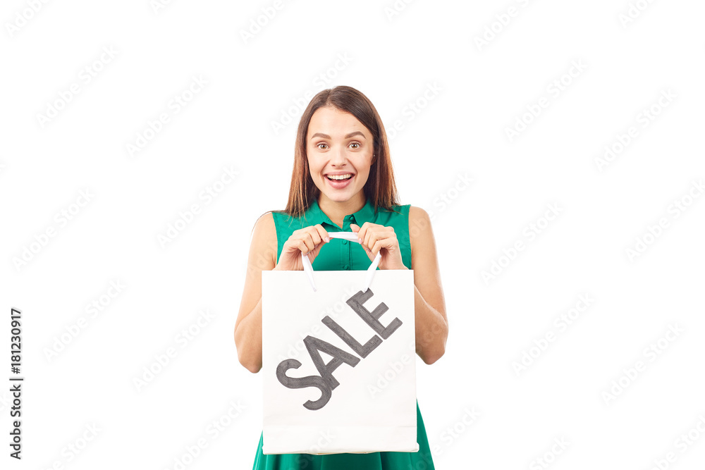 Portrait of female shopaholic holding shopping bags with sale/discount sign Portrait of female shopaholic holding shopping bags with sale/discount sign