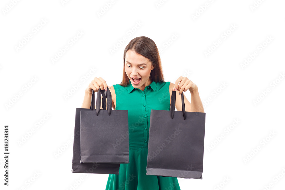 Portrait of female shopaholic holding black shopping bags Portrait of female shopaholic holding black shopping bags