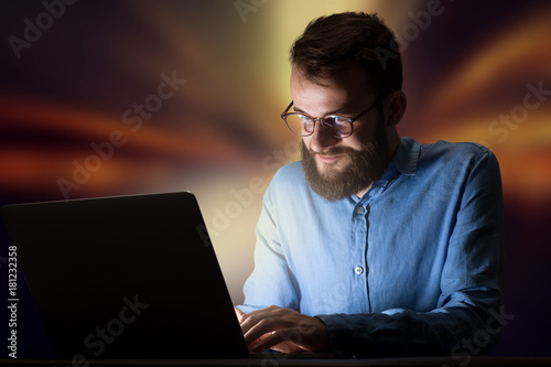 Businessman in the office at night