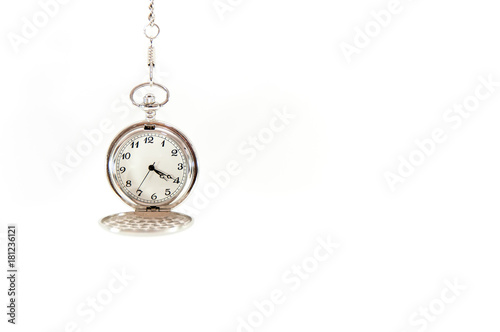 Old, hanging pocket watch isolated on white background.