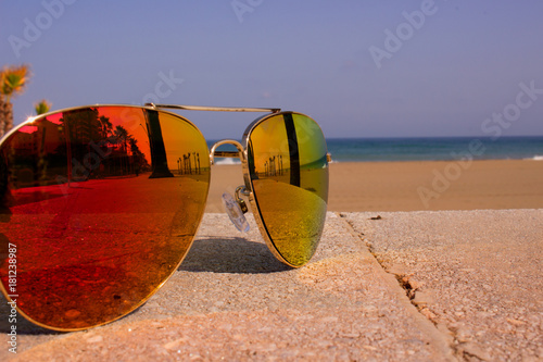 Sunglasses. Beautiful summer beach and sunglasses. Costa del Sol, Andalusia, Spain.
