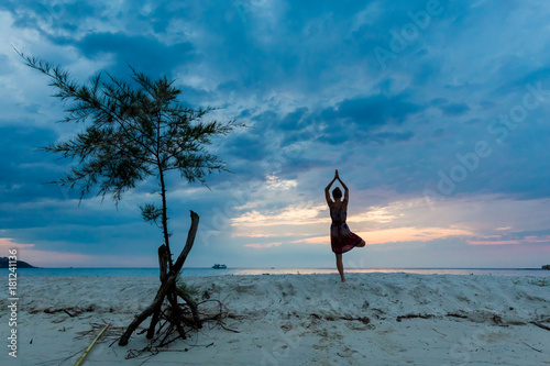 Yoga on tropical Thailand beach photo