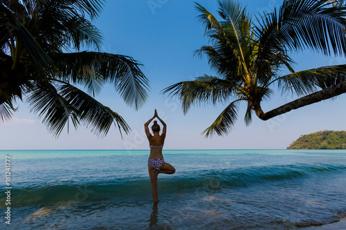 Yoga on tropical Thailand beach photo