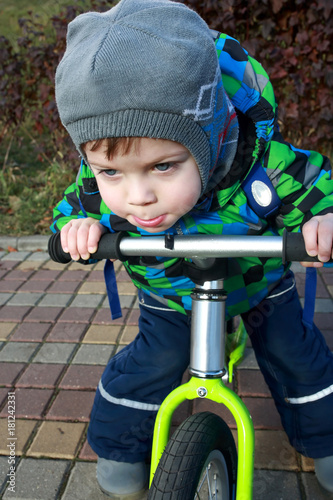 Boy using balance bike