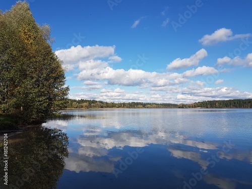 Lake Yalchik in Mari El in Russia in autumn, the clouds are reflected in the lake as in a mirror