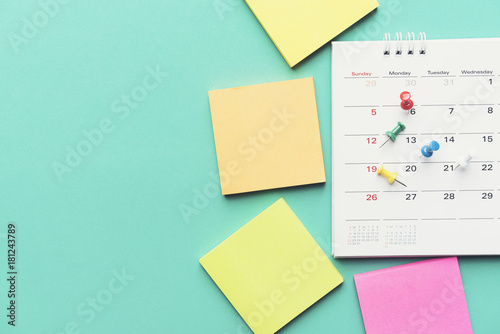 close up of calendar on green background, planning for business meeting or travel planning concept