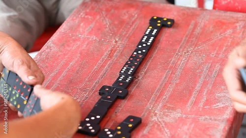 Vietnamese play dominoes