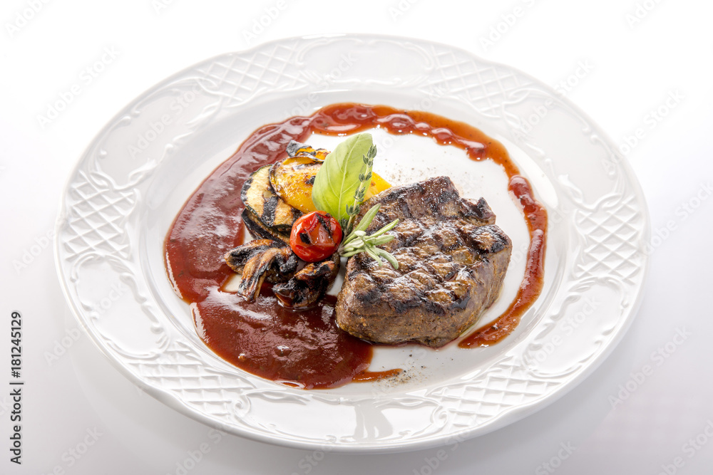 Grilled meat with vegetables on a plate Grilled meat with vegetables on a plate
